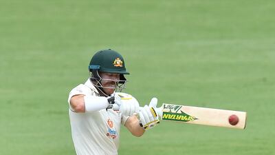 Australia opener David Warner hits a four on his way to 48 at the Gabba.