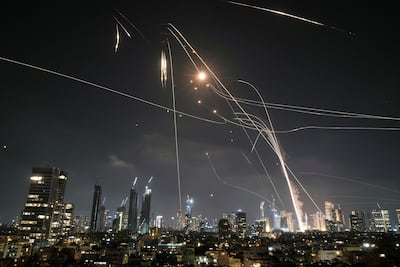 Israeli air defence systems intercept missiles over Tel Aviv. AP