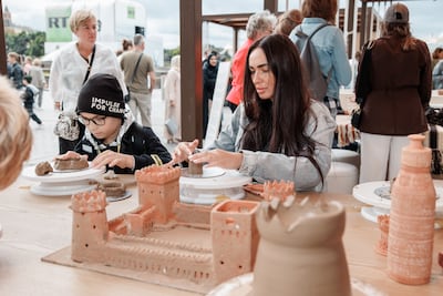 Visitors take part in a pottery workshop at Discover Abu Dhabi in Moscow. Photo: National Media Authority