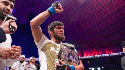 Timur Khizriev celebrates after winning the 2024 PFL World Championship featherweight belt.