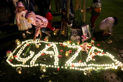 Children attend a candlelit vigil in London marking the first anniversary of the start of the Israel-Gaza war. Reuters