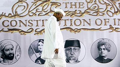 Anna Hazare, the leader of India's anti-corruption movement, walks on stage last month to tell his followers that he would end his fast a day earlier than planned.