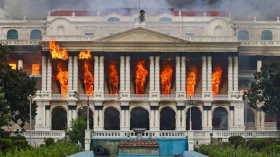 Fire rages through the Singha Durbar, the main administrative building for the Nepali government, in Kathmandu, a day after a police crackdown on demonstrations over social media prohibitions and corruption by the government. AFP