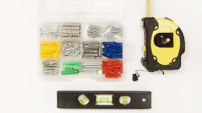 A level, measuring tape and assortment of screws and anchors will serve you well.