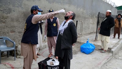 Afghans are screened as they cross from Pakistan, at Toorkham border, Afghanistan. EPA
