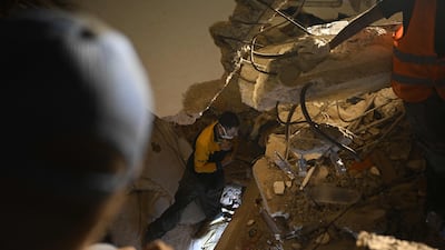 People search the debris of a collapsed building in the Los Corales neighbourhood of Caraballeda, La Guaira state. AFP