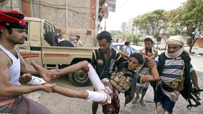 Fighters of the Popular Resistance Committees rush a comrade to a hospital after he was injured during clashes with Houthi fighters in Yemen's southwestern city of Taez on May 15. Reuters