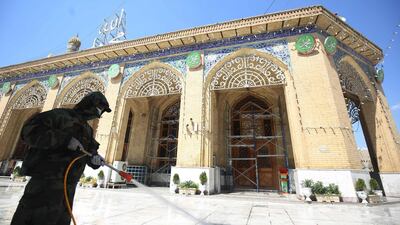 Members of the Iraqi civil defence disinfect the mausoleum of Imam Abu Hanifa al-Numan in Baghdad's Sunni Muslim district of Aadhamiya. AFP