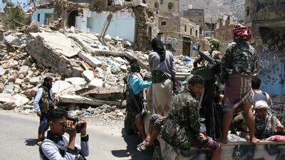 Pro-government tribal fighters patrol a street during in the war-torn city of Taez in south-west Yemen during a visit by a UN delegation on April 9, 2017. Coalition and government forces are battling to take rebel-held port cities on the Red Sea coast to the east. Anees Mahyoub / Reuters