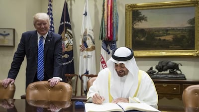 Sheikh Mohamed bin Zayed, Crown Prince of Abu Dhabi and Deputy Supreme Commander of the UAE Armed Forces, signs the guest book upon arriving at the White House for a meeting with US president Donald Trump on May 15, 2017. Ryan Carter / Crown Prince Court - Abu Dhabi