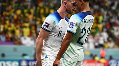 England's Jordan Henderson celebrates scoring their first goal with Jude Bellingham. AFP