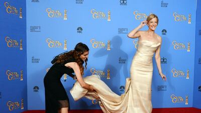 Anna Gunn, right, poses in the press room. AP