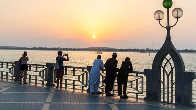 A sunset stroll along the Corniche shows many of Abu Dhabi's charms. Antonie Robertson/The National