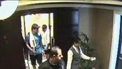 Mahmoud al Mabhouh is followed out of a lift by two alleged Mossad agents.