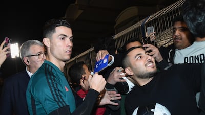 Ronaldo signing autographs and taking selfies before the training session.Getty