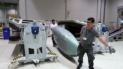Workers working on the parts for Airbus and Boeing in the Autoclave section at the Strata Manufacturing facility in Al Ain. Pawan Singh/The National