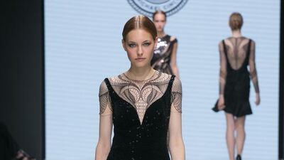 Cinco’s timeless black numbers boasted intricate embroidery, applique flowers and crystals. Courtesy Michael Cinco and Couturissimo