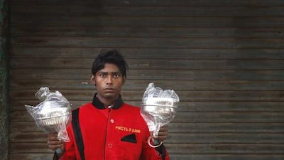 Kapil Singh, 19, from Jhansi,a member of Master Band specializing in playing weddings, poses for a portrait in New Delhi.