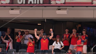 Spanish actors Javier Bardem, centre left, and Penelope Cruz, centre right, celebrate during their team's quarter-final win over Belgium. AFP