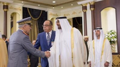 Sheikh Mohammed bin Zayed, Crown Prince of Abu Dhabi and Deputy Supreme Commander of the Armed Forces, second right, greets a guest from the Moroccan delegation. Seen with them is Sheikh Hazza bin Zayed, National Security Advisor and Vice Chairman of the Abu Dhabi Executive Council, right. Ryan Carter / Crown Prince Court - Abu Dhabi