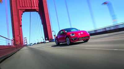 The latest Beetle, pictured on the Golden Gate Bridge in San Francisco, remains a ‘cute’ car, despite the 2014 model’s notably more powerful silhouette and attempts to reposition it as a more ‘masculine’ proposition. Courtesy Volkswagen