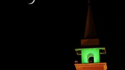 A crescent moon is seen above a mosque on the second day of Ramadan in Beirut, Lebanon on June 19, 2015. Jamal Saidi / Reuters