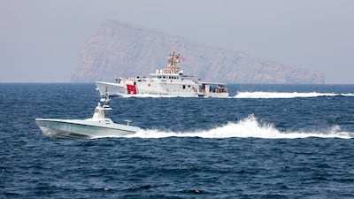 A US Navy L3 Harris Arabian Fox Mast-13 drone boat and the US Coast Guard cutter John Scheuerman in the Strait of Hormuz on Wednesday. USCG via AP