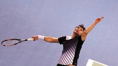 Tunisia's Malek Jaziri won the first set against Roger Federer before losing 5-7, 6-0, 6-2 in the first round of the Dubai Duty Free Tennis Championships on Monday. Marwan Naamani / AFP