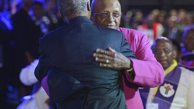South Africa's archbishop emeritus Desmond Tutu, right, and the former South African President Thabo Mbeki greet each other before the funeral ceremony. Odd Andersen / EPA