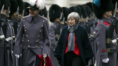 Britain's Prime Minister Theresa May inspects a military parade in London. Dan Kitwood / pool via AP