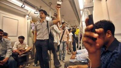 People rode on the Delhi Metro Rail train yesterday, as factories and offices across India were up and running again after two days of power outages.