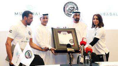 UAE jiu-jitsu captain Faisal Al Ketbi, Abdulmunam Al Hashemi, president of UAEJJF, Homaid Al Shimmari, Mubadala deputy group CEO, and Shamma Al Kalbani, national player, during the press conference held in Abu Dhabi on October 6. Pawan Singh / The National