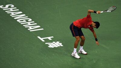 Novak Djokovic of Serbia smashing his racket after losing a point against Roberto Bautista Agut of Spain in their men's singles semi-finals match at the Shanghai Masters tennis tournament in Shanghai. Johannes Eisele / AFP
