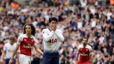 Tottenham's Heung-Min Son, center, reacts after missing a chance to score. AP Photo