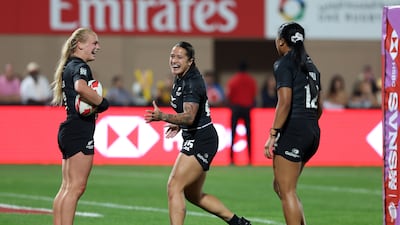 New Zealand's Jorja Miller celebrates scoring a try