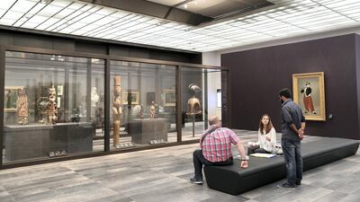 Visitors take pause at Louvre Abu Dhabi. Chris Whiteoak / The National