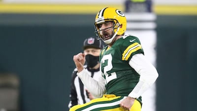 Green Bay Packers quarterback Aaron Rodgers celebrates after a touchdown pass to wide receiver Allen Lazard during the second half of a NFC Divisional Round playoff game against the Los Angeles Rams at Lambeau Field. Reuters