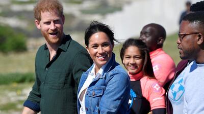 The Duke and Duchess of Sussex, Prince Harry and his wife Meghan, meet with members of the NGO Waves For Change, during their African tour, on Monwabisi Beach in Cape Town, South Africa. REUTERS