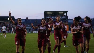 Players on the Palestine team celebrate a goal during the friendly match against the Bohemians Women. PA