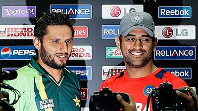 Shahid Afridi, left, and MS Dhoni, the captains of Pakistan and India at the news conference before their semi-final encounter in Mohali tomorrow.