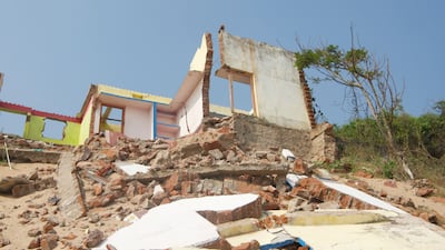 Houses after houses, with their cracked walls and broken sills have long been abandoned by their inhabitants in the ghost village situated less than 200 metres from the shore.