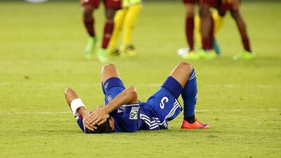 An Al Nasr player slumps to the ground following his side’s defeat in the President’s Cup final.