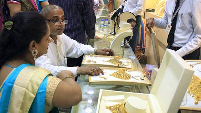 Customers buy gold jewellery at Tribhuvandas Bhimji Jhaveri at Jhaveri Bazaar in Mumbai. Subhash Sharma for The National