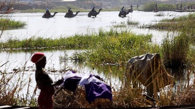 Men on camels cross a section of Lake Chad near the village of Ngouboua, Chad. Reuters