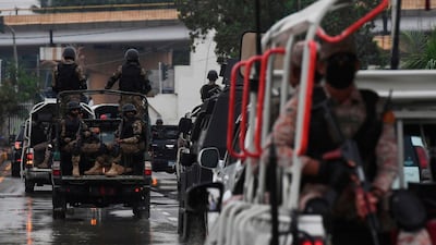 Soldiers escort vehicles carrying Sri Lankan and Pakistani cricket teams as they leave the National Cricket Stadium in Karachi. AFP