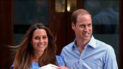 Britain's Prince William and his wife Catherine, Duchess of Cambridge appear with their baby son, outside the Lindo Wing of St Mary's Hospital. REUTERS / Suzanne Plunkett