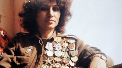 Mohammadzai wears her army uniform adorned with medals in the 1980s.