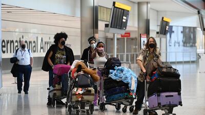 Travellers at Heathrow Airport. EPA