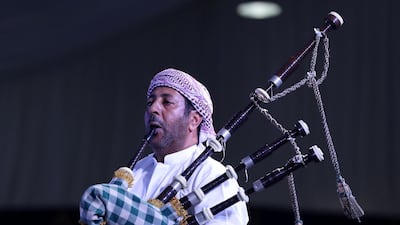 An entertainer hits the right note during the celebration of UAE tradition.