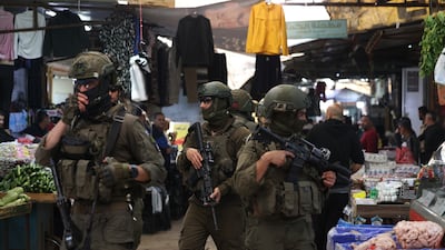Israeli soldiers patrol the market in the Old City of Nablus. EPA